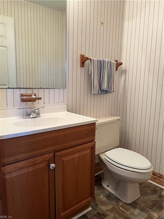 bathroom with vanity and toilet