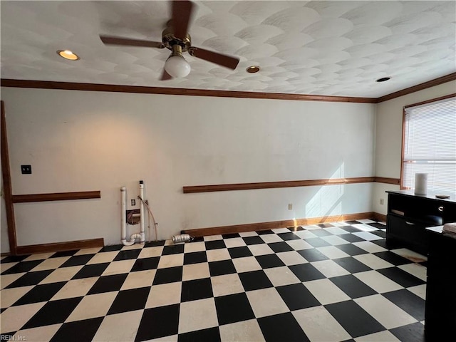 interior space with ceiling fan and crown molding