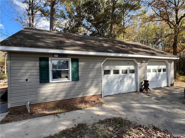 view of side of home with a garage