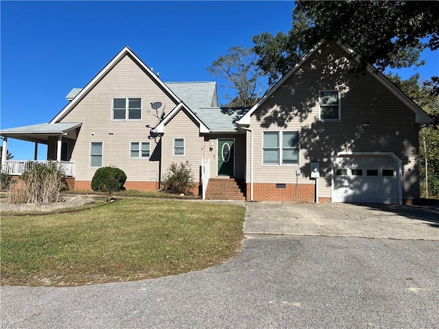 view of front of property featuring a garage and a front lawn