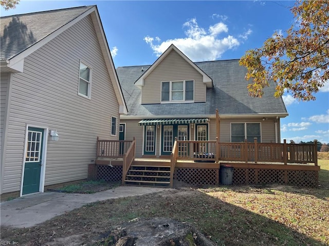 back of property featuring a wooden deck