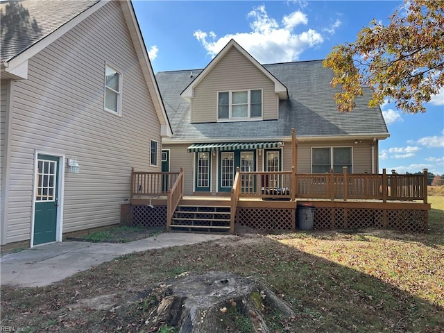 back of house featuring a wooden deck