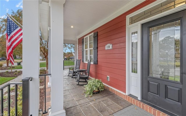 view of patio featuring a porch