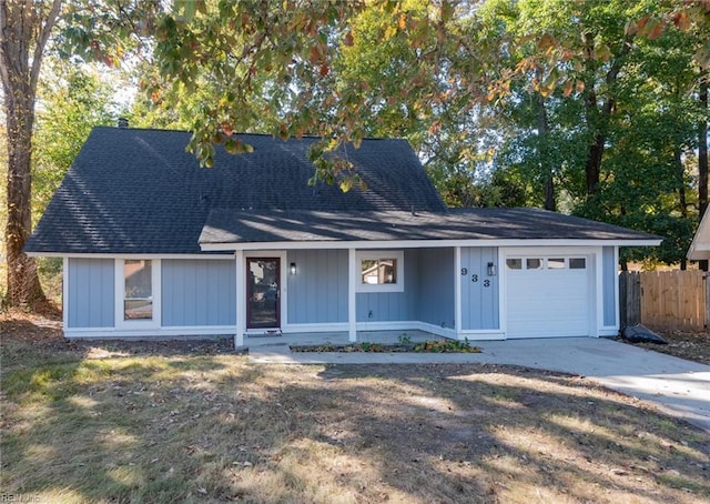 view of front of house with a garage and covered porch