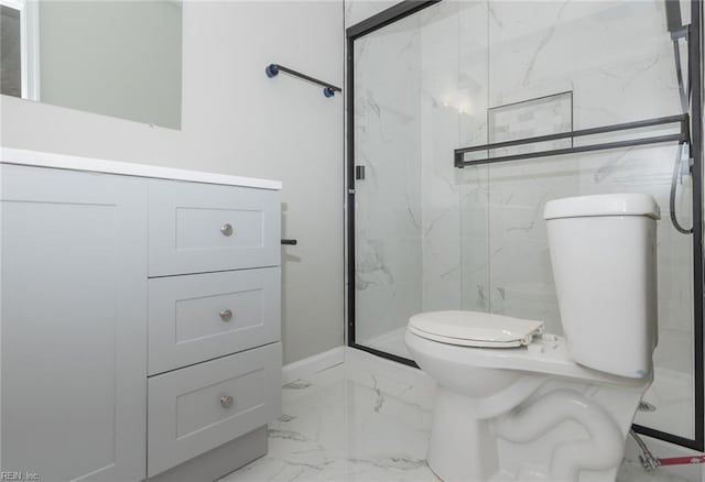 bathroom with toilet, vanity, and walk in shower