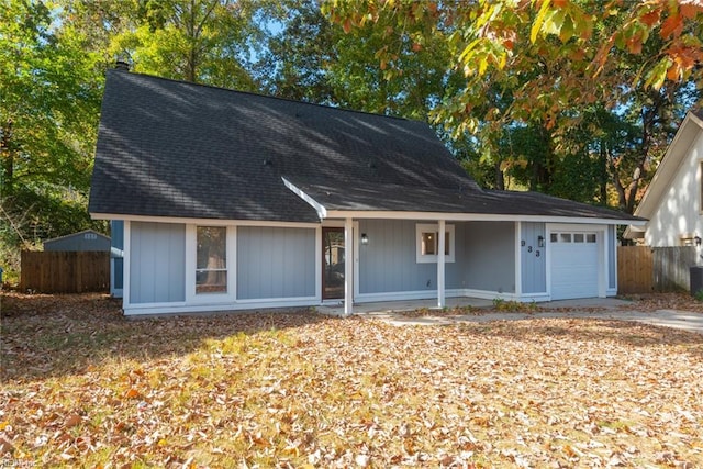 view of front of house featuring a garage and covered porch