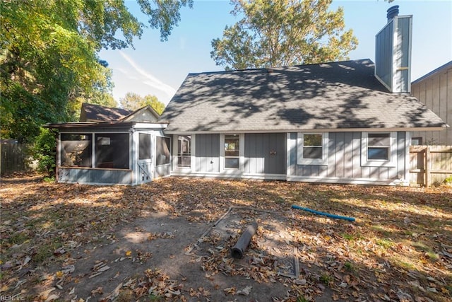 back of house featuring a sunroom