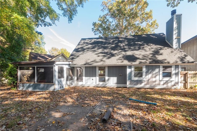 back of house with a sunroom