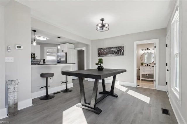 interior space with a wealth of natural light and light hardwood / wood-style flooring