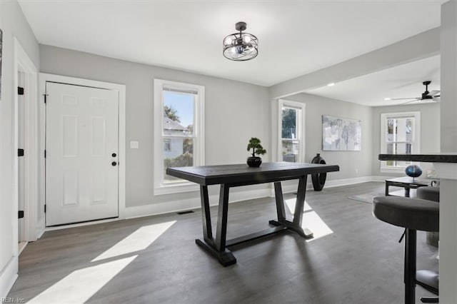 office with hardwood / wood-style flooring and ceiling fan