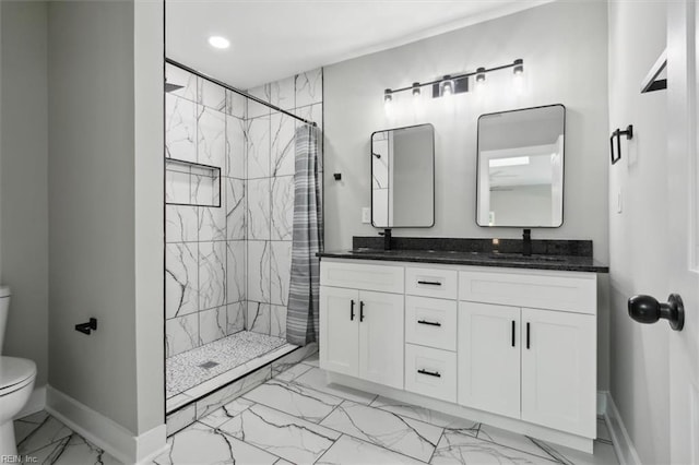 bathroom with walk in shower, vanity, and toilet