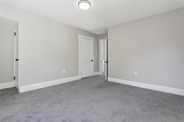 unfurnished room featuring carpet floors