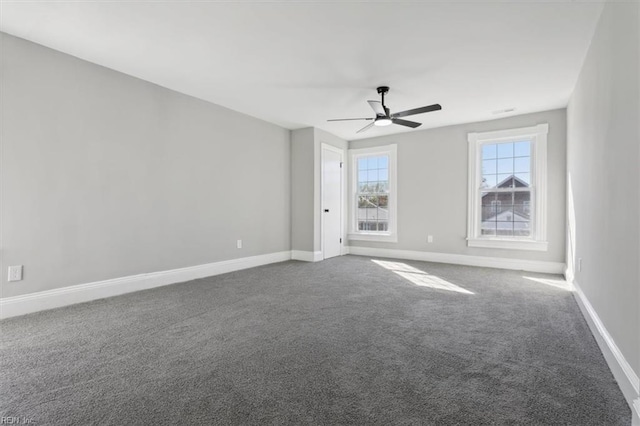 carpeted spare room featuring ceiling fan