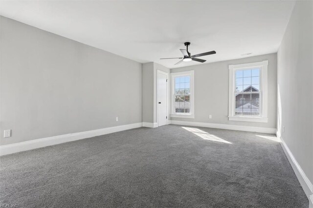 318 Sycamore Ave, Newport News, VA 23607 - empty room with dark colored carpet, a ceiling fan, and baseboards
