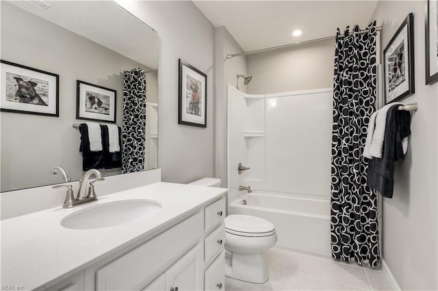 full bathroom featuring tile patterned flooring, vanity, shower / bath combination with curtain, and toilet