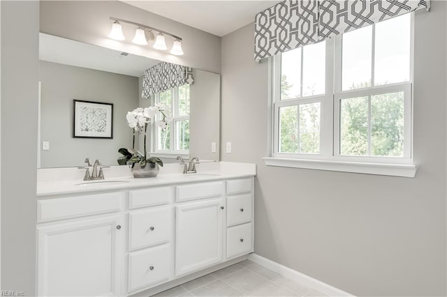 bathroom featuring tile patterned flooring and vanity