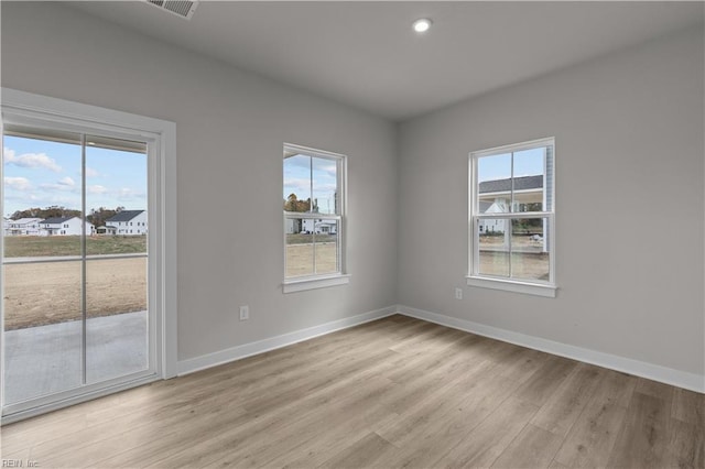 unfurnished room featuring light wood-type flooring