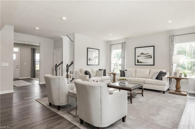 living room with dark hardwood / wood-style flooring