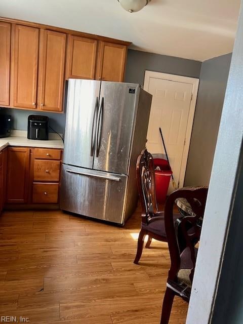 kitchen featuring stainless steel fridge and light wood-type flooring