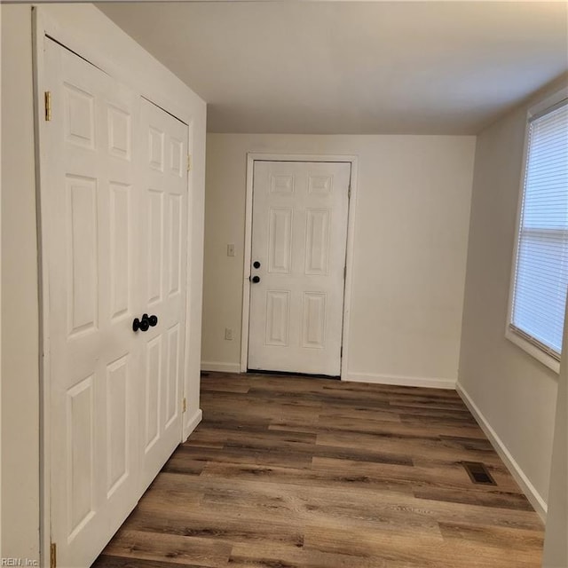 interior space with dark hardwood / wood-style flooring