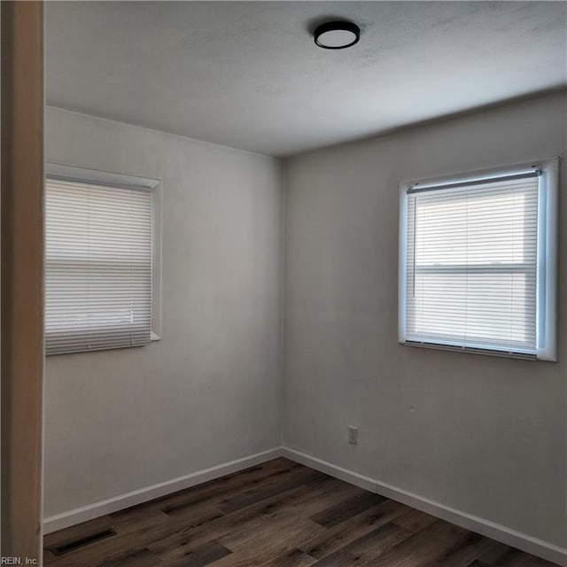 empty room featuring dark hardwood / wood-style floors