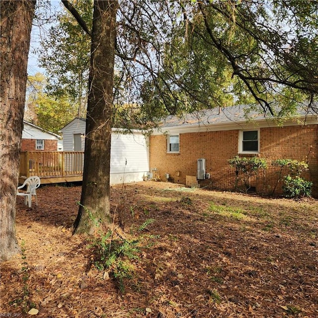 back of property with a wooden deck