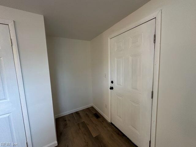 doorway to outside with dark wood-type flooring