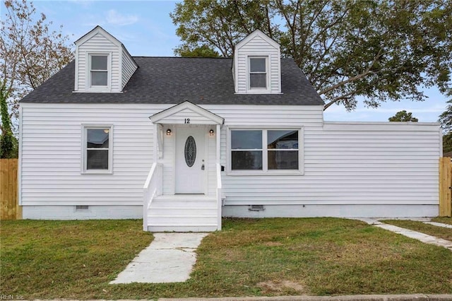 cape cod-style house featuring a front yard