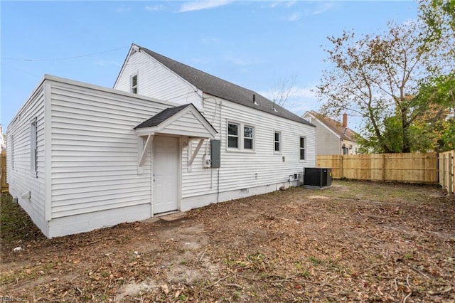 back of house featuring central air condition unit