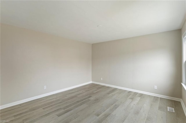 spare room featuring light hardwood / wood-style flooring