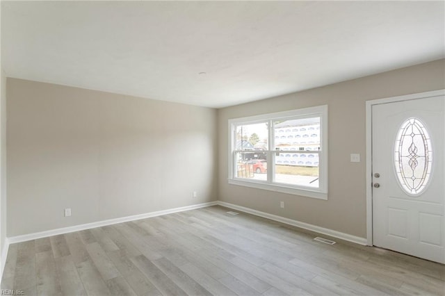 entryway with light hardwood / wood-style flooring