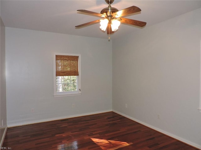 unfurnished room featuring ceiling fan and dark hardwood / wood-style flooring