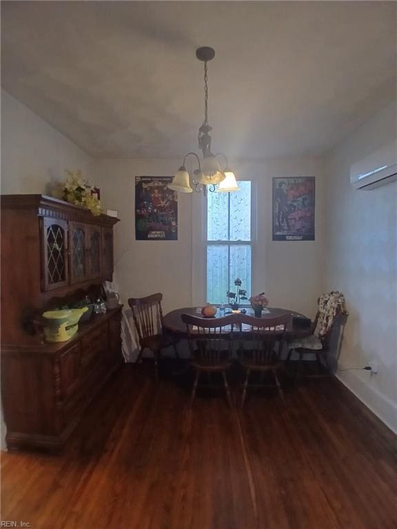 dining room featuring a wall mounted AC, dark wood-type flooring, and a notable chandelier