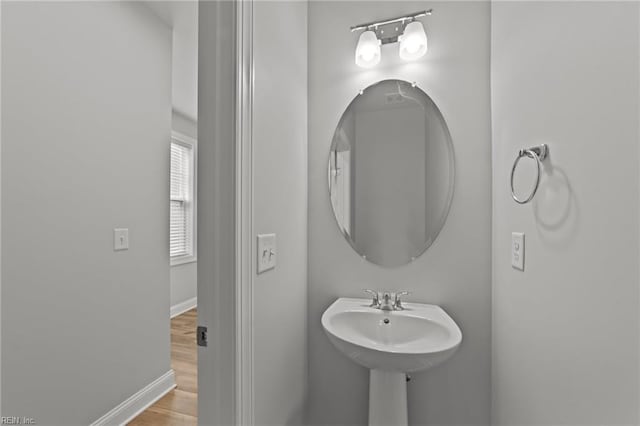 bathroom with hardwood / wood-style flooring