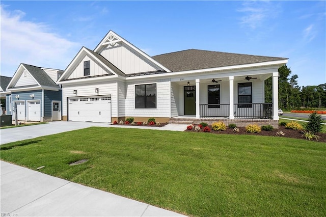 view of front facade featuring a porch, a front yard, a garage, and ceiling fan