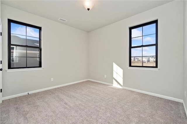 empty room featuring carpet flooring