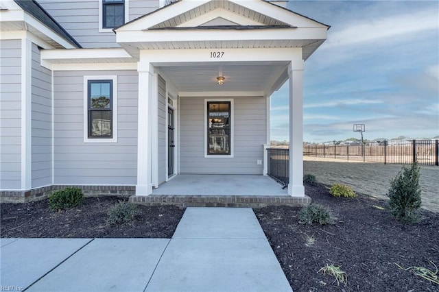 property entrance featuring a porch