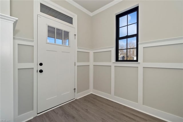 foyer entrance featuring dark wood-type flooring and ornamental molding