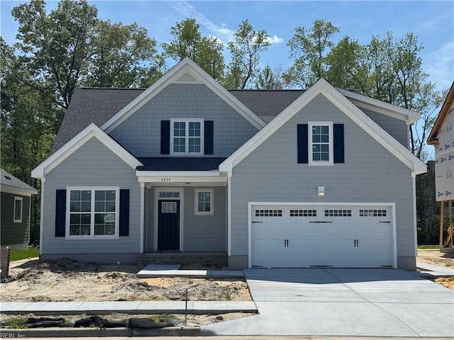 5039 Annapolis Dr, Chesapeake, VA 23321 - view of front of house with driveway, an attached garage, and a shingled roof