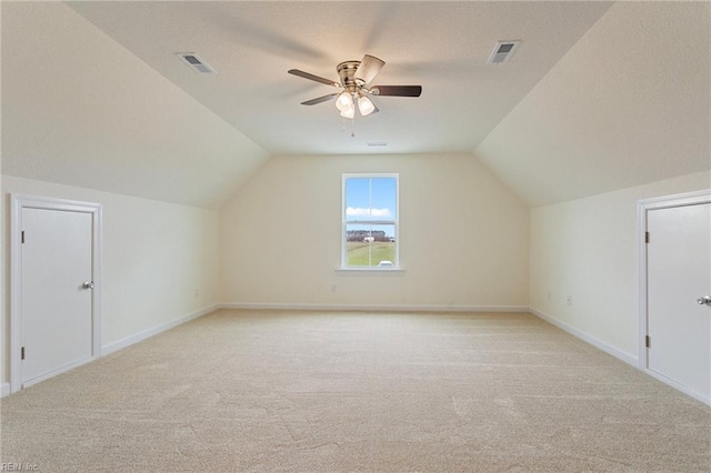 bonus room with visible vents, light colored carpet, and lofted ceiling