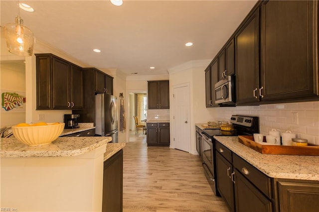 5043 Annapolis Dr, Chesapeake, VA 23321 - kitchen with stainless steel appliances, ornamental molding, backsplash, light stone counters, and light wood-type flooring