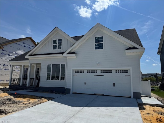 5043 Annapolis Dr, Chesapeake, VA 23321 - view of front of house with board and batten siding, driveway, covered porch, and fence
