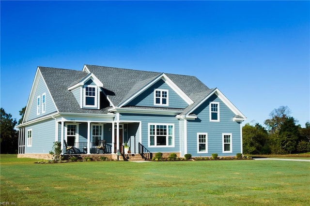 5043 Annapolis Dr, Chesapeake, VA 23321 - view of front facade featuring covered porch, a front lawn, and a shingled roof