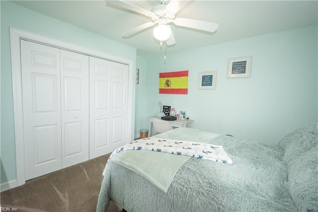 carpeted bedroom featuring a closet and ceiling fan