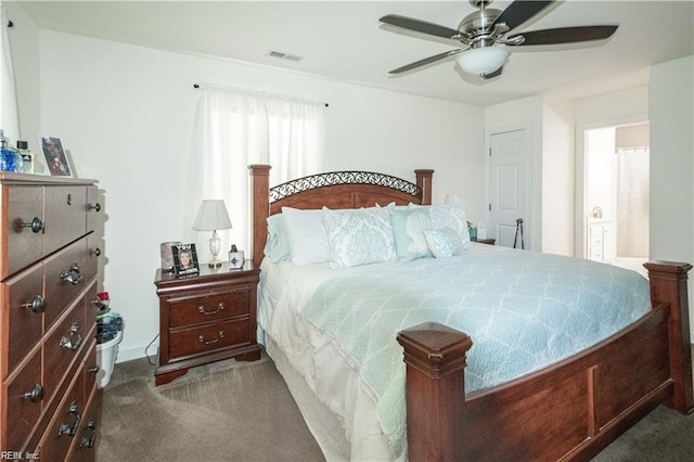 bedroom with ceiling fan and dark carpet