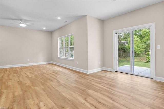 unfurnished room featuring light hardwood / wood-style flooring, ceiling fan, and plenty of natural light