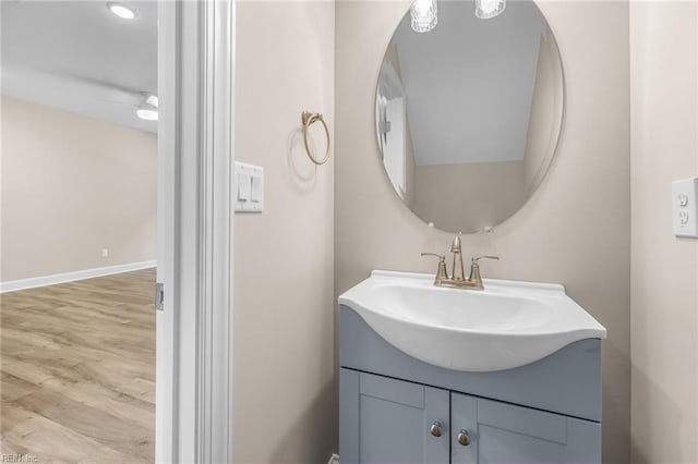 bathroom with vanity, wood-type flooring, and ceiling fan