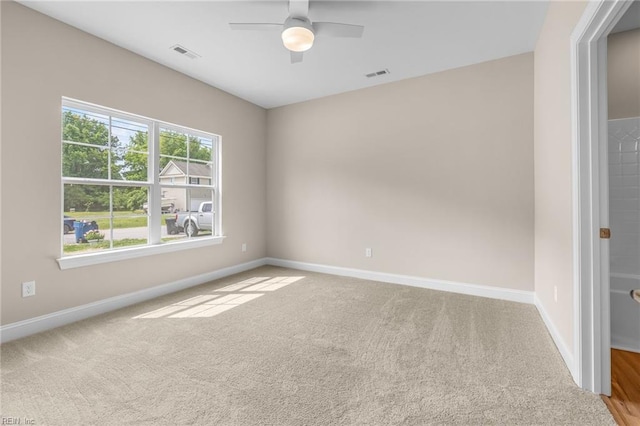 empty room with carpet floors and ceiling fan