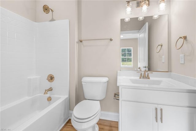 full bathroom with hardwood / wood-style floors, shower / bath combination, toilet, and vanity