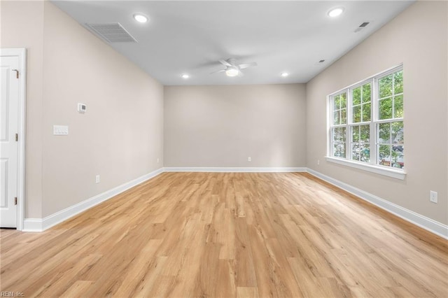 spare room with ceiling fan and light hardwood / wood-style flooring